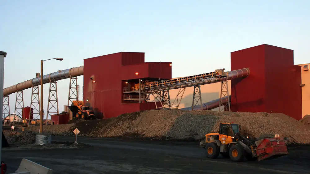 Front-end loaders working outside the ore processing plant at an open pit mine